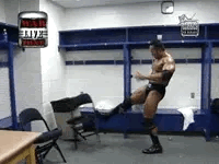 The Rock storms through the WWE locker room, kicking chairs and flipping tables